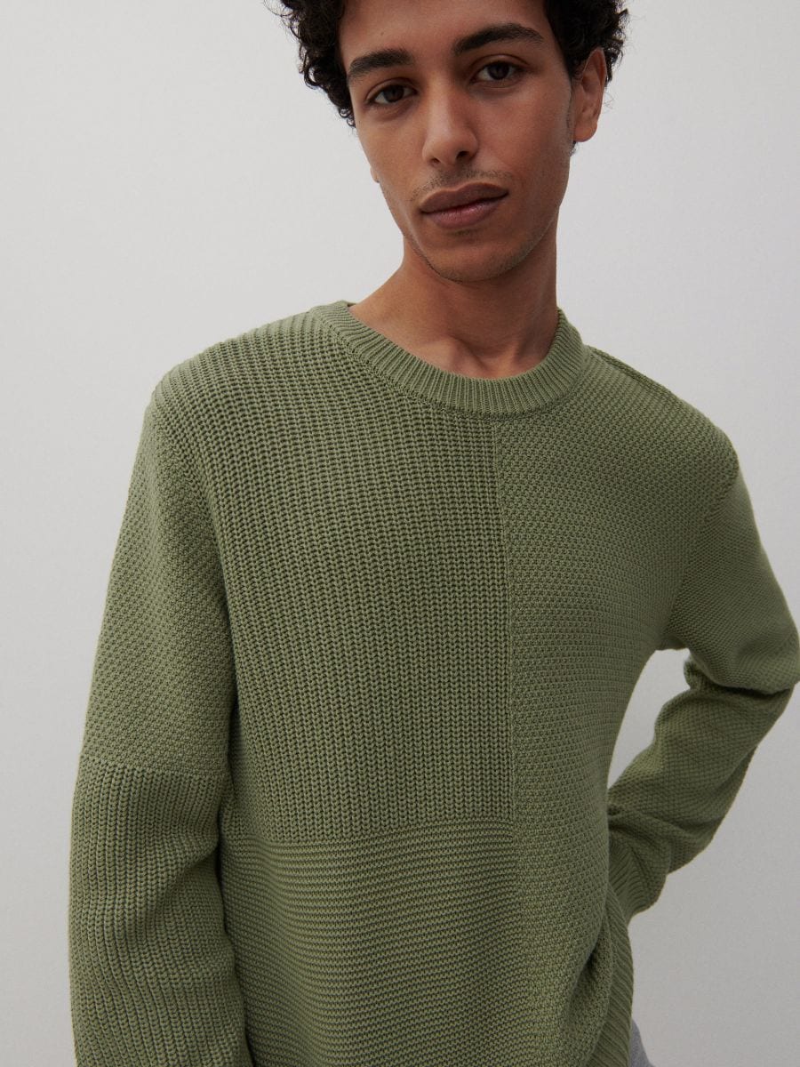 green knit jumper